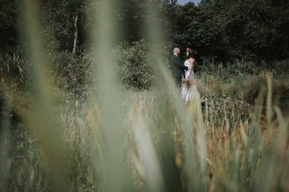 wedding photo by pond