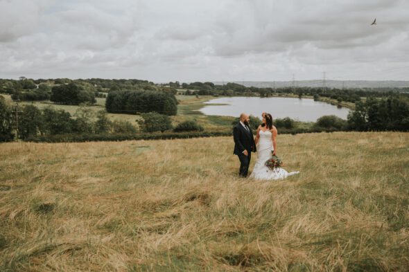 married couple in a field